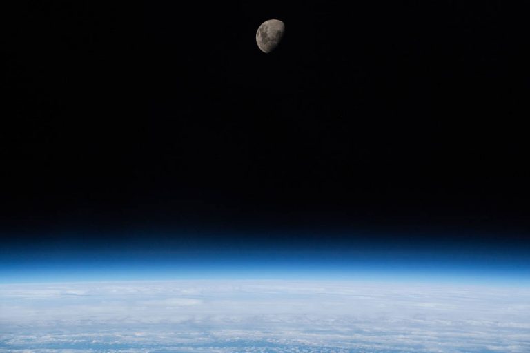 Waxing Gibbous Moon Above Earth’s Limb